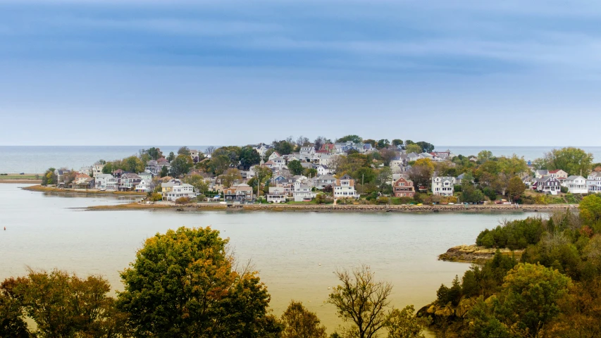 a river with homes on the land below