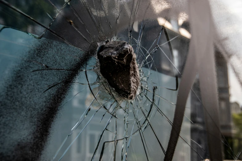 a ed up window showing the damage of glass