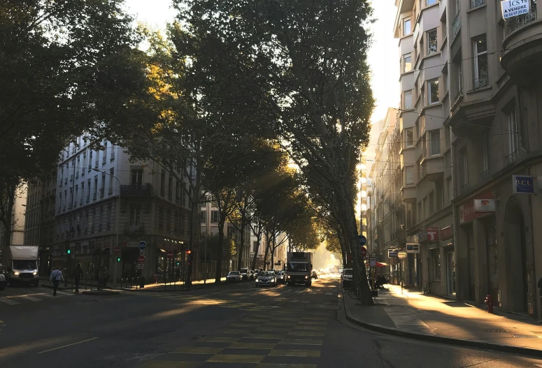 a street that has some cars driving on it