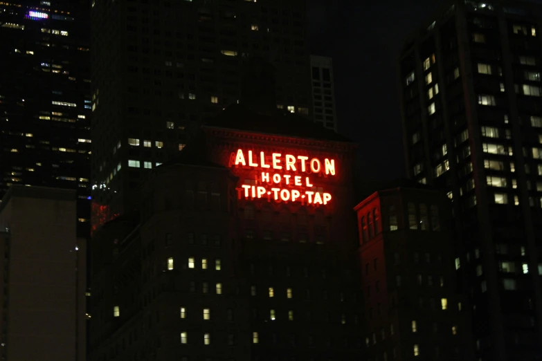 a sign above the el's tip - bar on a skyscr