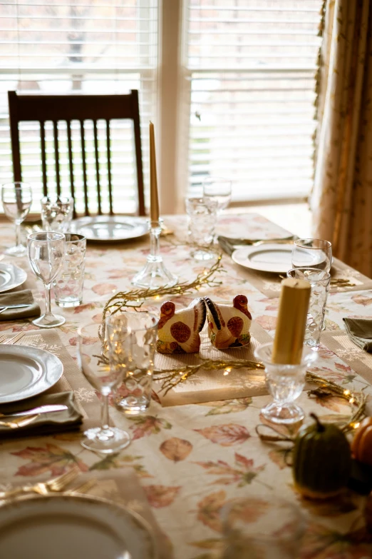 a table that has plates and glasses on it