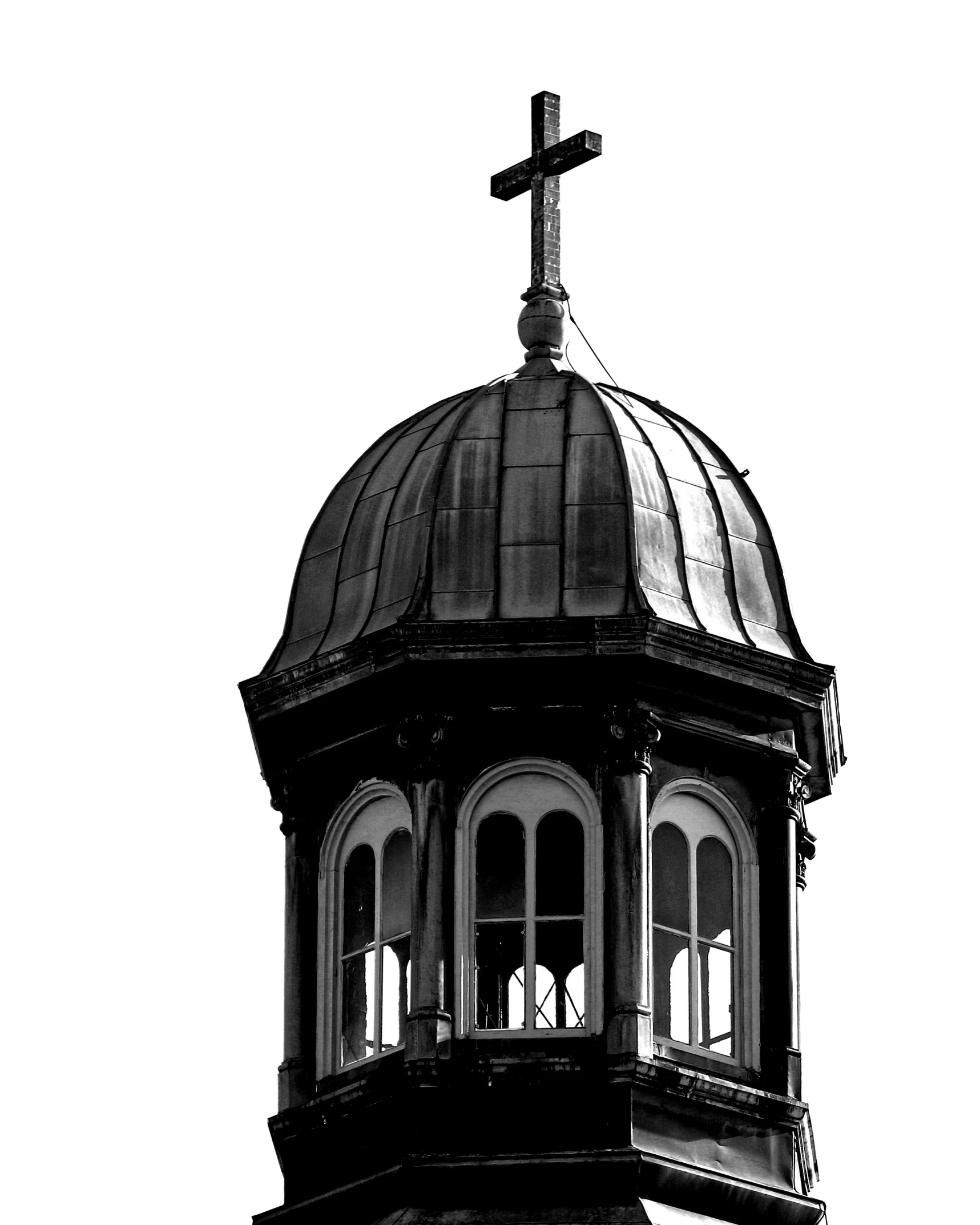 a church steeple with a cross and an antenna