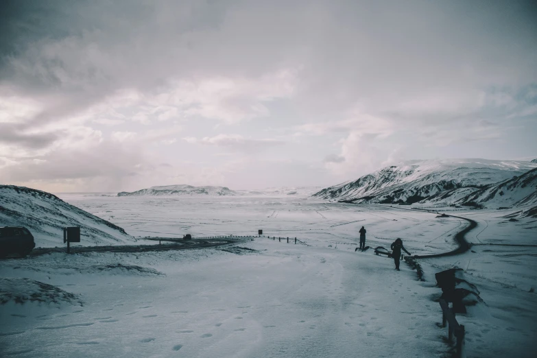 an overcast day in the desert, people are out for some snow