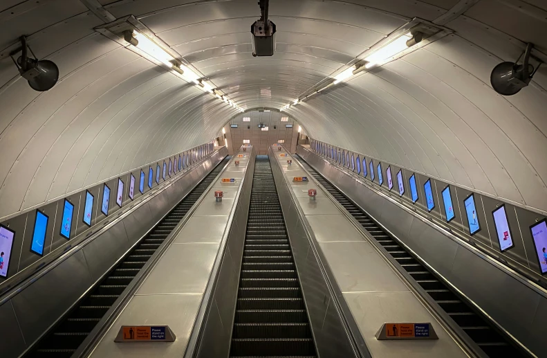 two escalators leading into an open tunnel