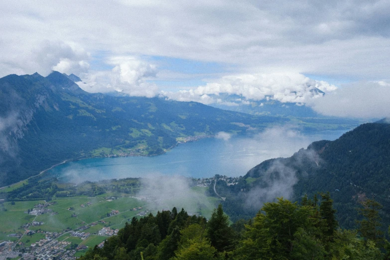 a view of a valley with mountains in the background