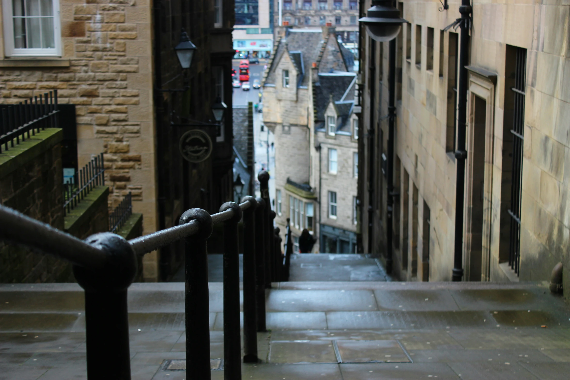 a couple of black bars on a stone building