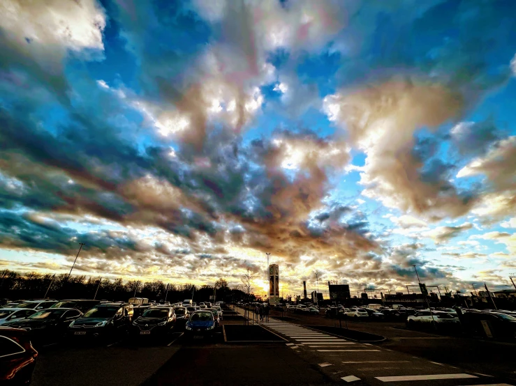 car park with cloudy skies on either side