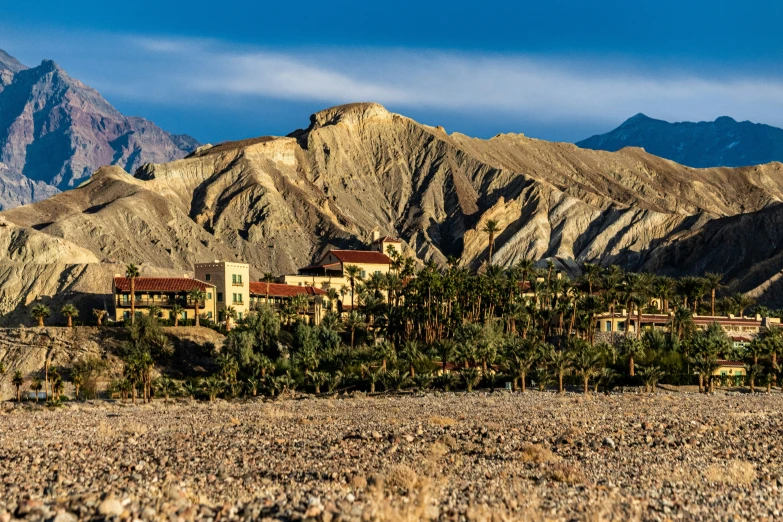 mountains and houses are seen in the background