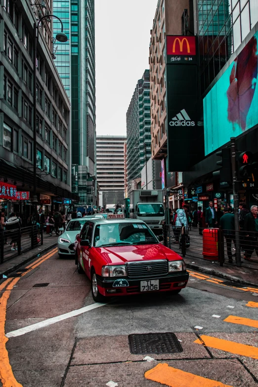 a car is driving through a large city street