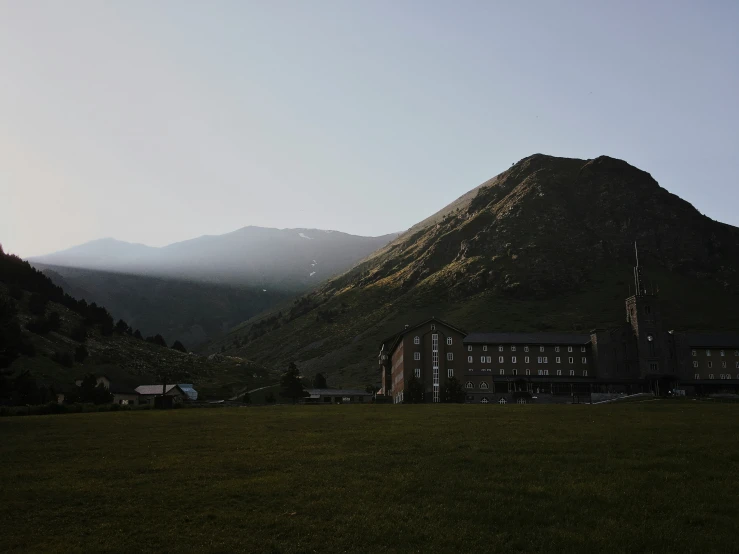 the view of a very big building in the mountain