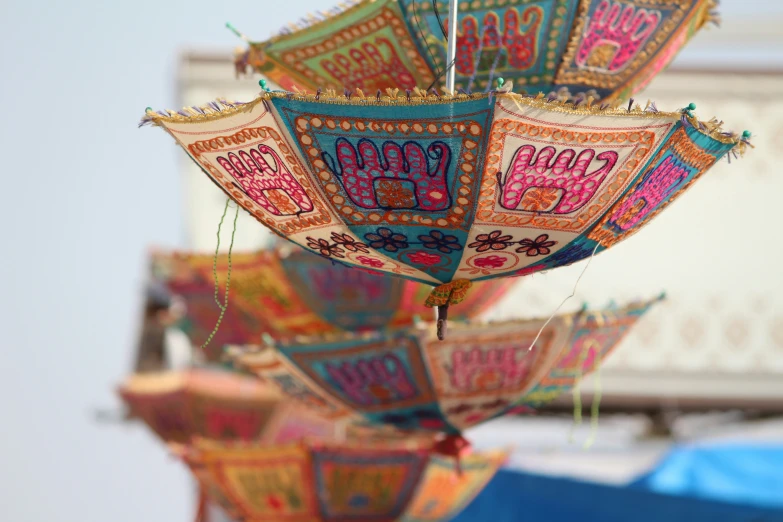 an umbrella decorated with many different designs and patterns