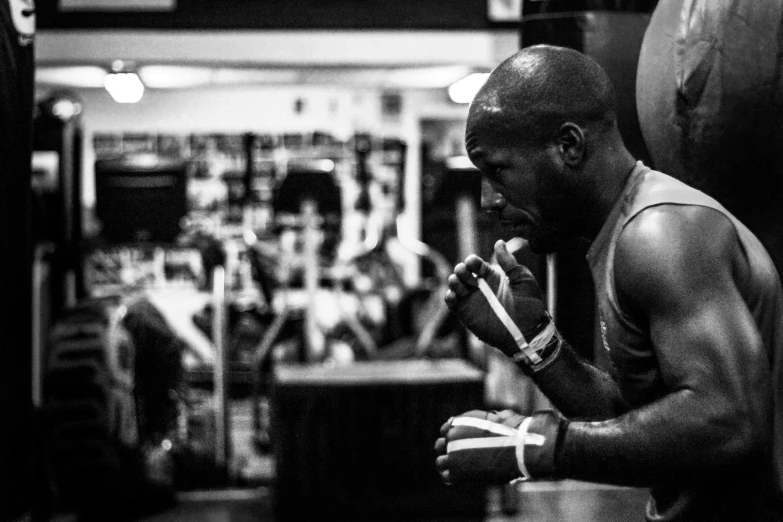 a man is talking on the phone in a gym