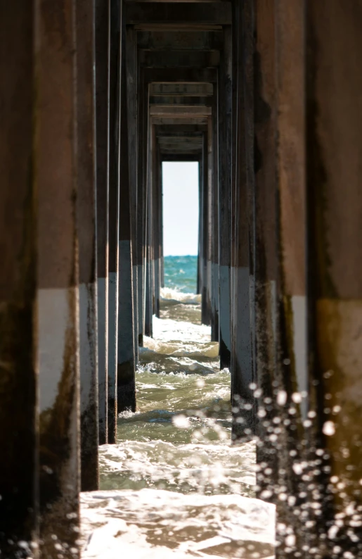 long columns leading into the ocean from a pier