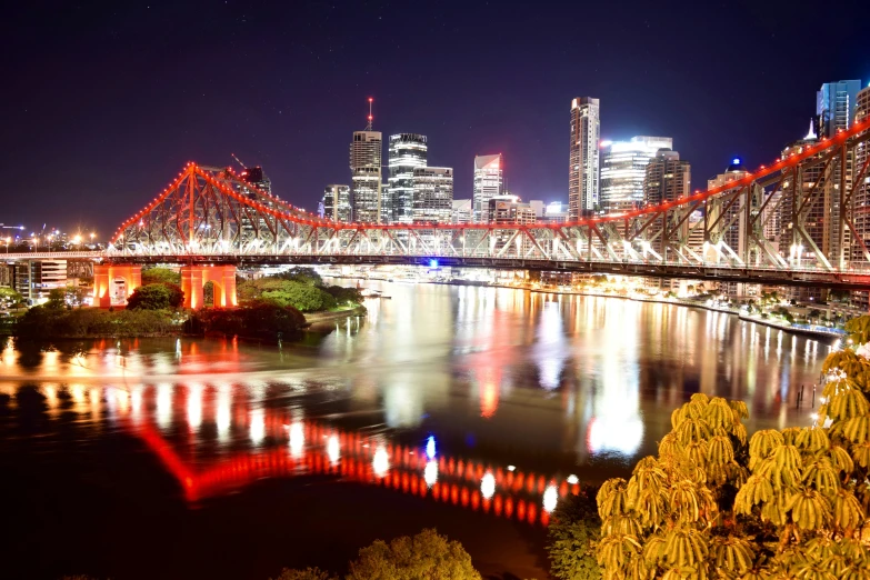 a very big nice looking bridge over a very large river