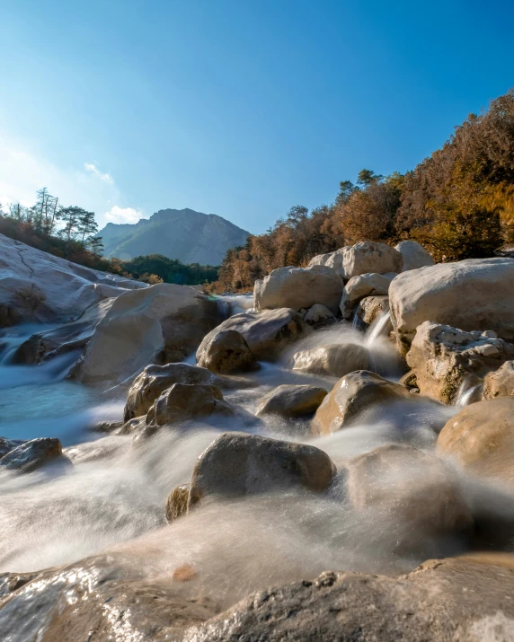 large rocks in the middle of a stream