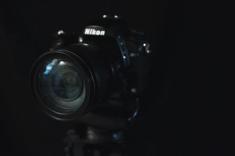 a camera is lit up in the dark