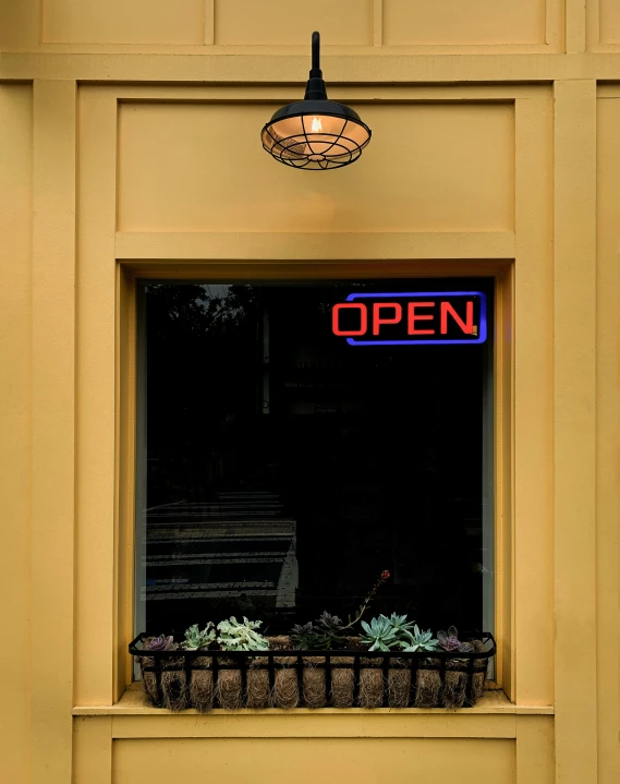 a window with two windows sitting below a light