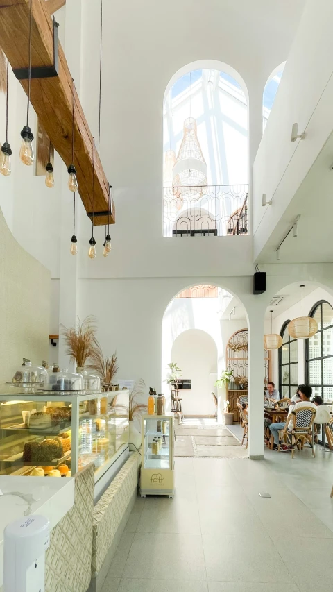 the restaurant has an arched ceiling and stone tile