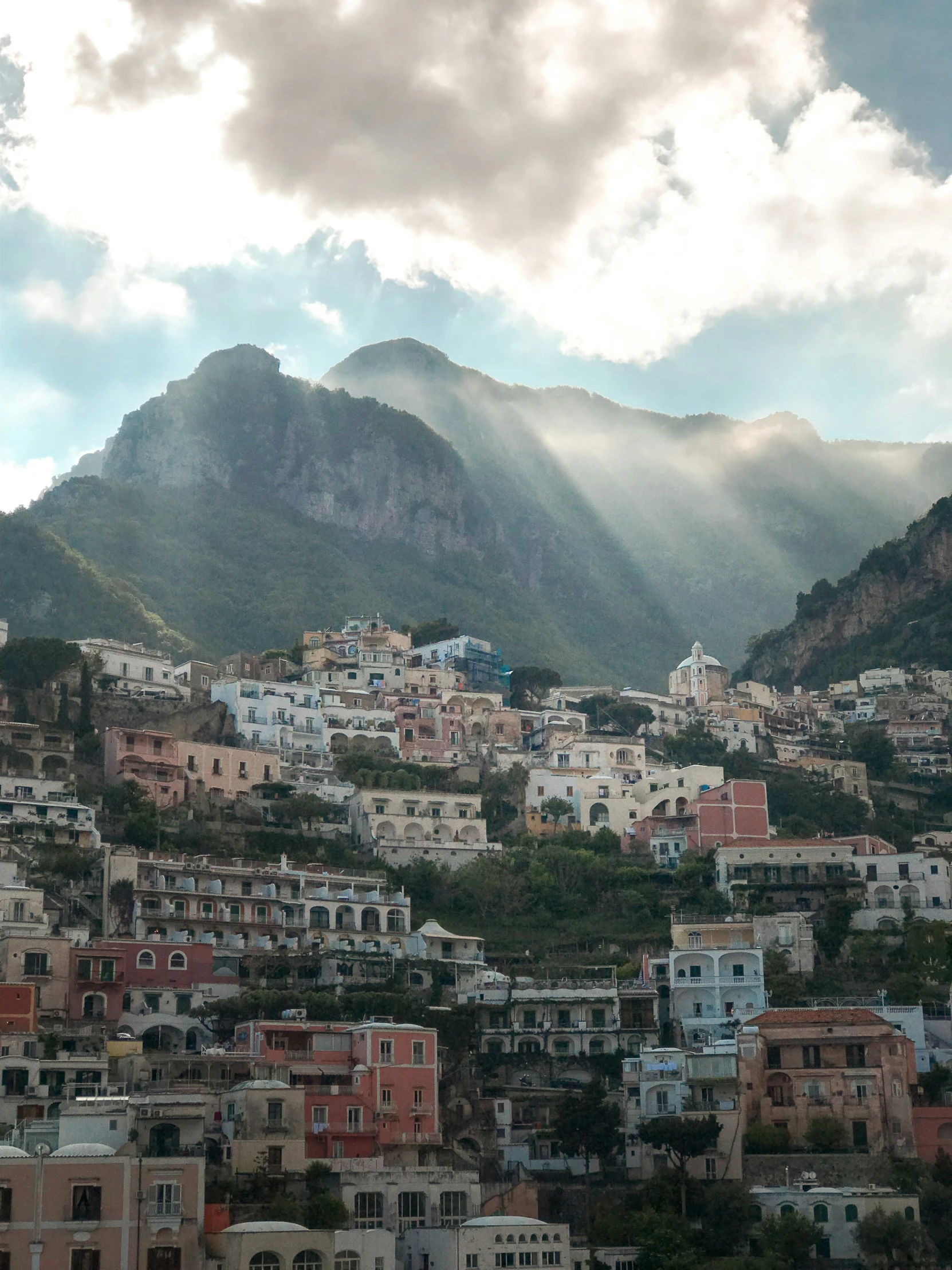 a very pretty city nestled beneath the mountain