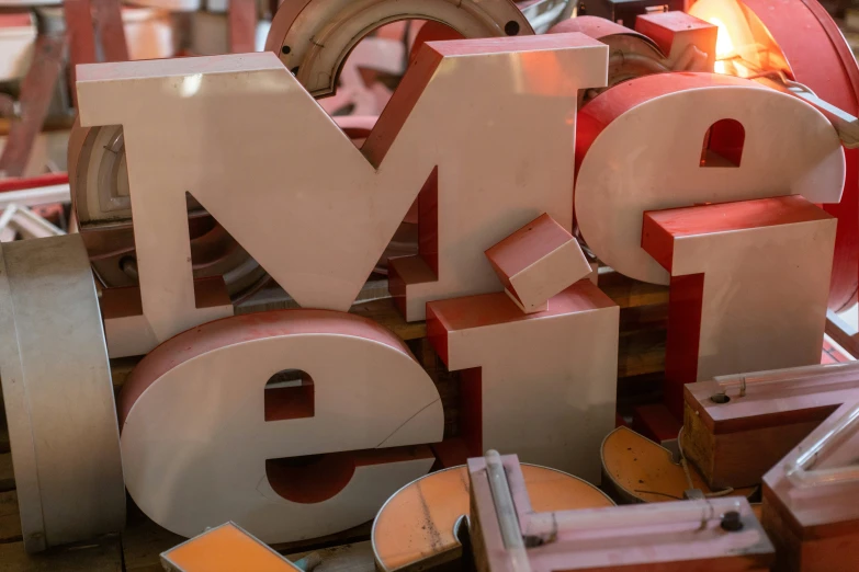 various wooden letters arranged together with a fire inside