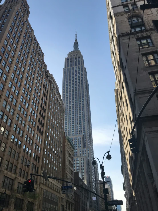 a very tall building near many other large buildings