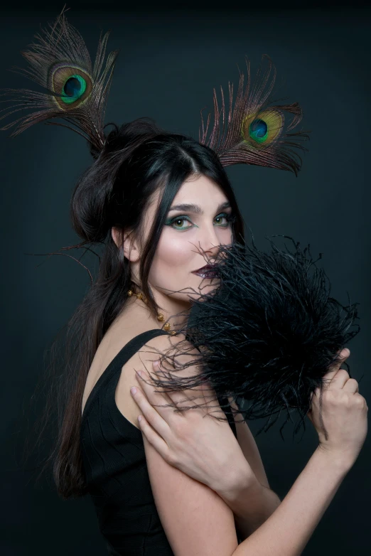 a woman with peacock feathers around her head