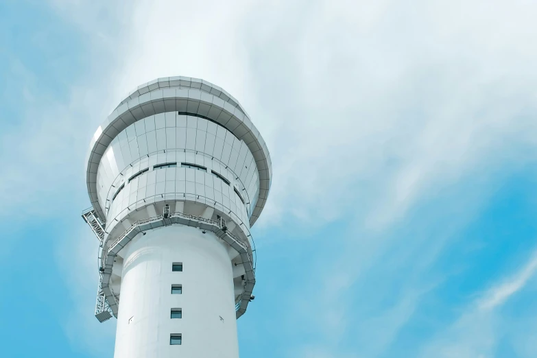 an architectural view of a tall white tower