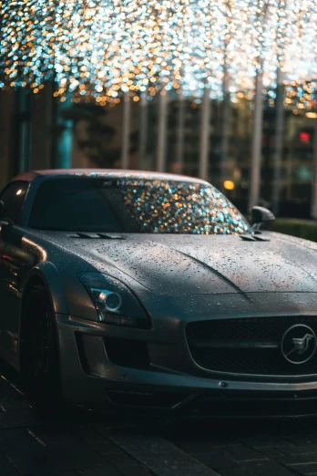 a silver masera convertible car with lights around it