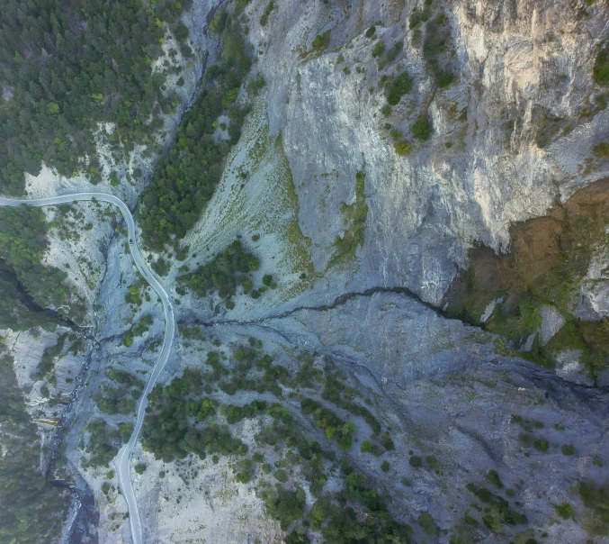 aerial view of river in mountainous area near roadway