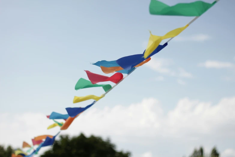 some colorful streamers flying on a clear day