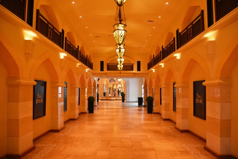 a walkway in a building with a lot of lights