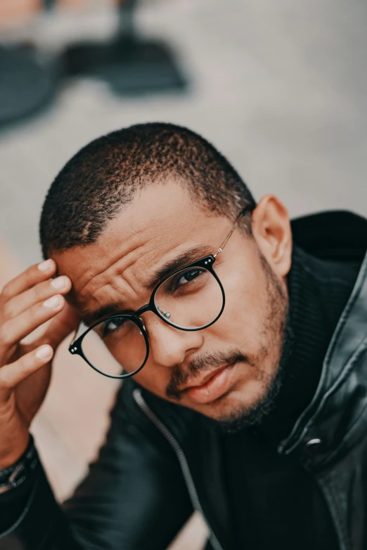 a close up of a person wearing glasses