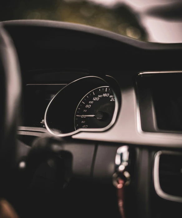 a po looking inside of the dashboard on a car