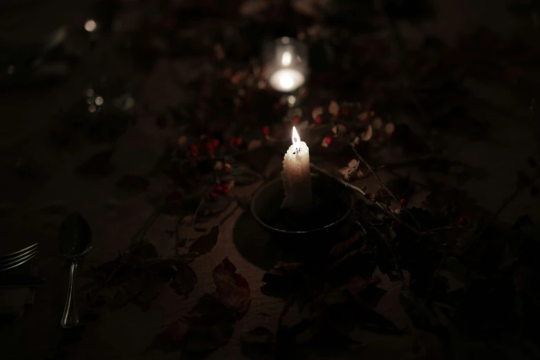 the candle is lit inside a bowl on the table