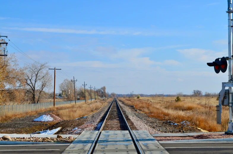 an empty rail road track going through the countryside