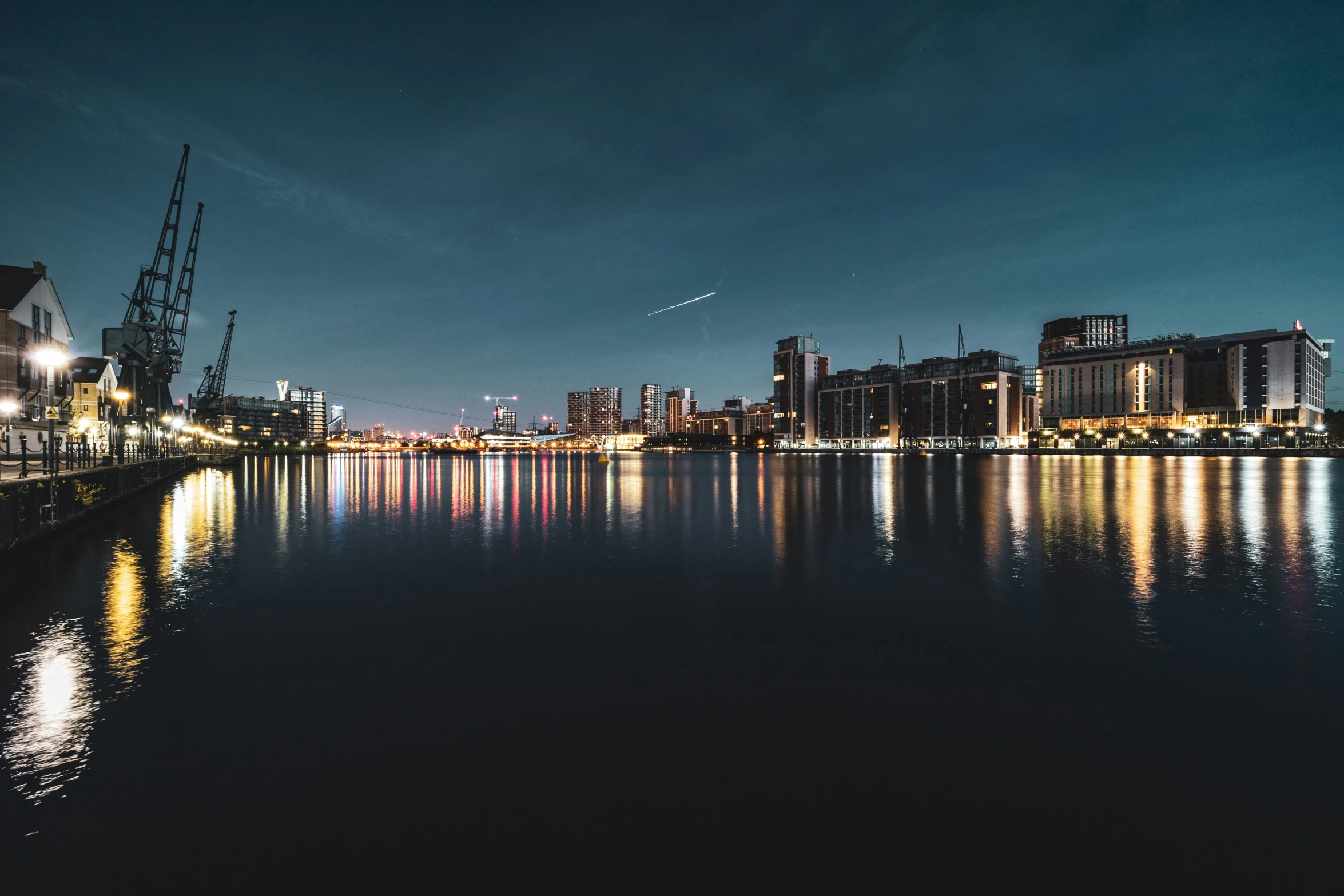 an image of a city with water and lights on