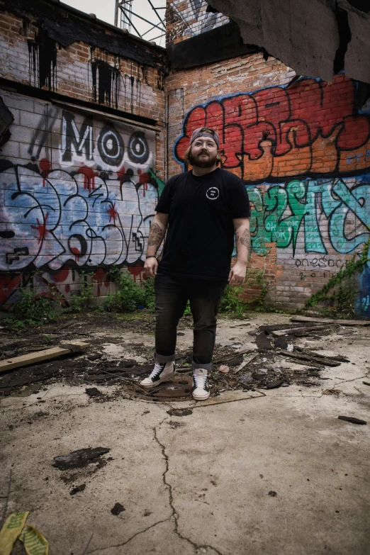 a man standing in an alley with his eyes closed