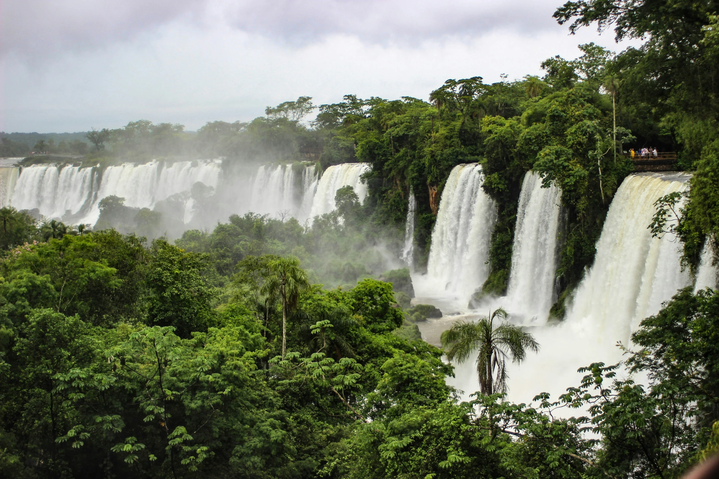 view from platform of several waterfalls and trees