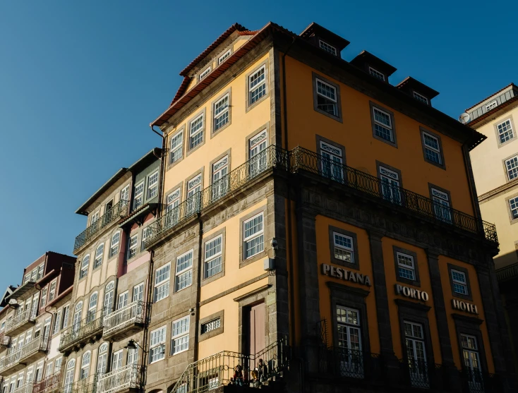 the top of an old building with some balconies