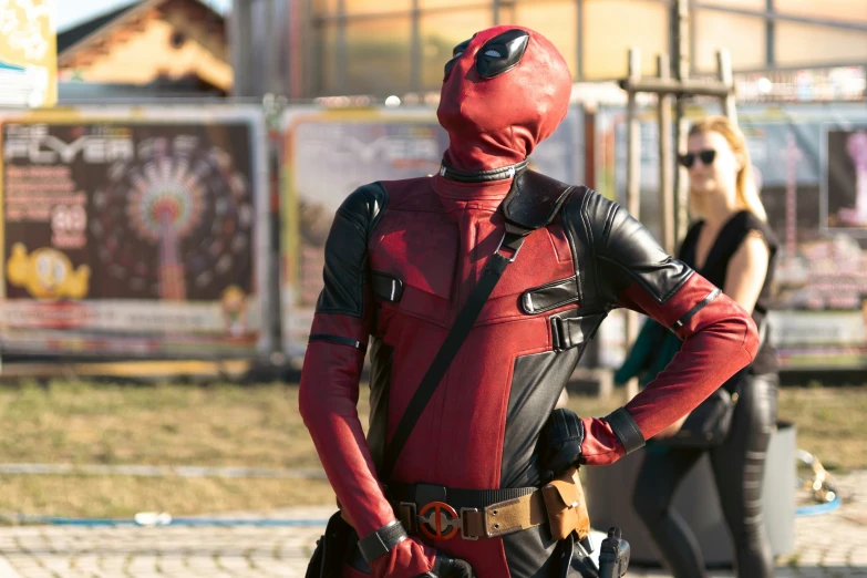 a man wearing a deadpool costume and goggles