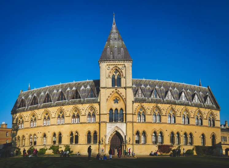 the large building has many towers and windows