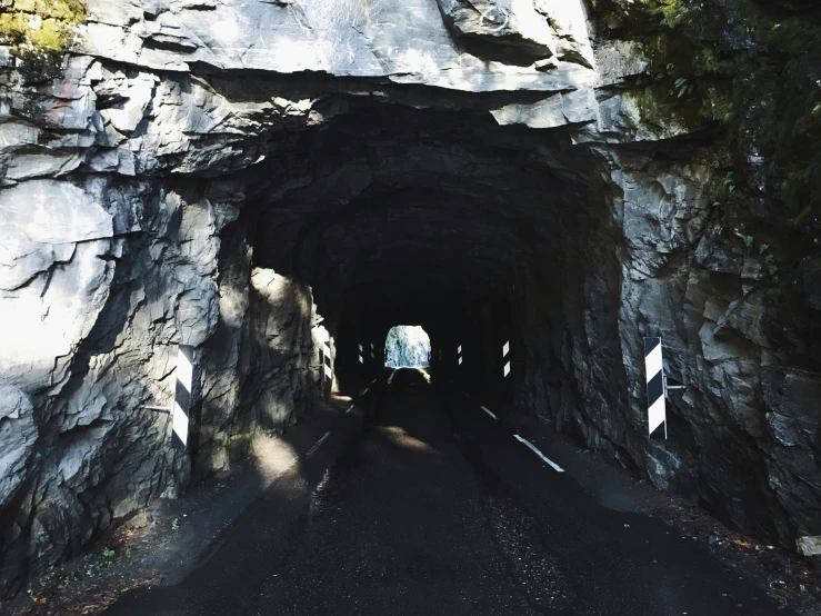 the entrance to a tunnel along a street