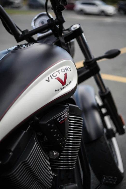 a motorcycle with victory insignia is parked on the street