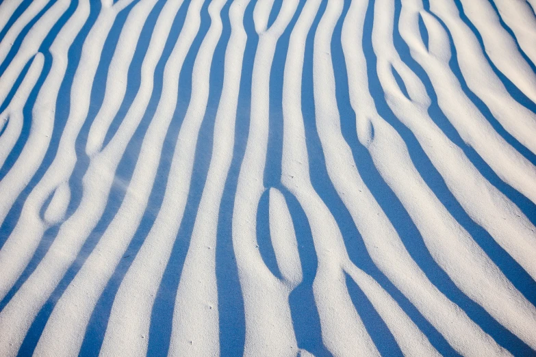 a striped fabric with wavy blue stripes