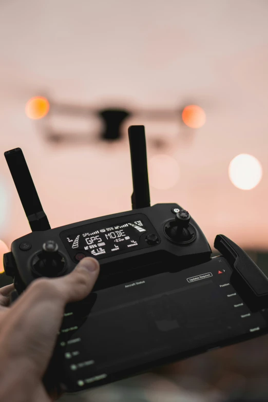 a person is holding up their radio to watch the sky