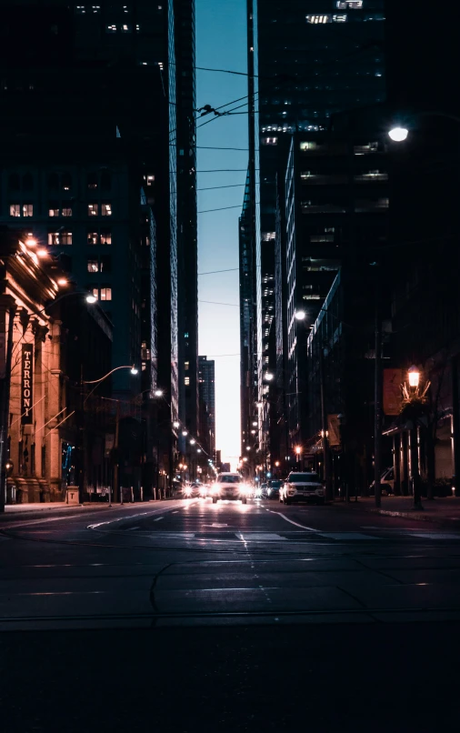 some buildings street lights cars and the sky