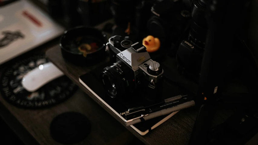 this is an analog camera with a rubber duck on the flash drive