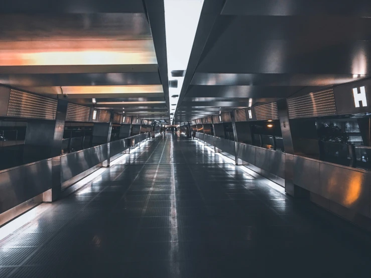 a long hallway with lights and no one on the ground