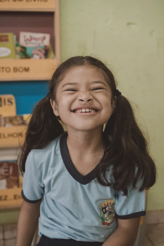 an adorable little girl smiles at the camera