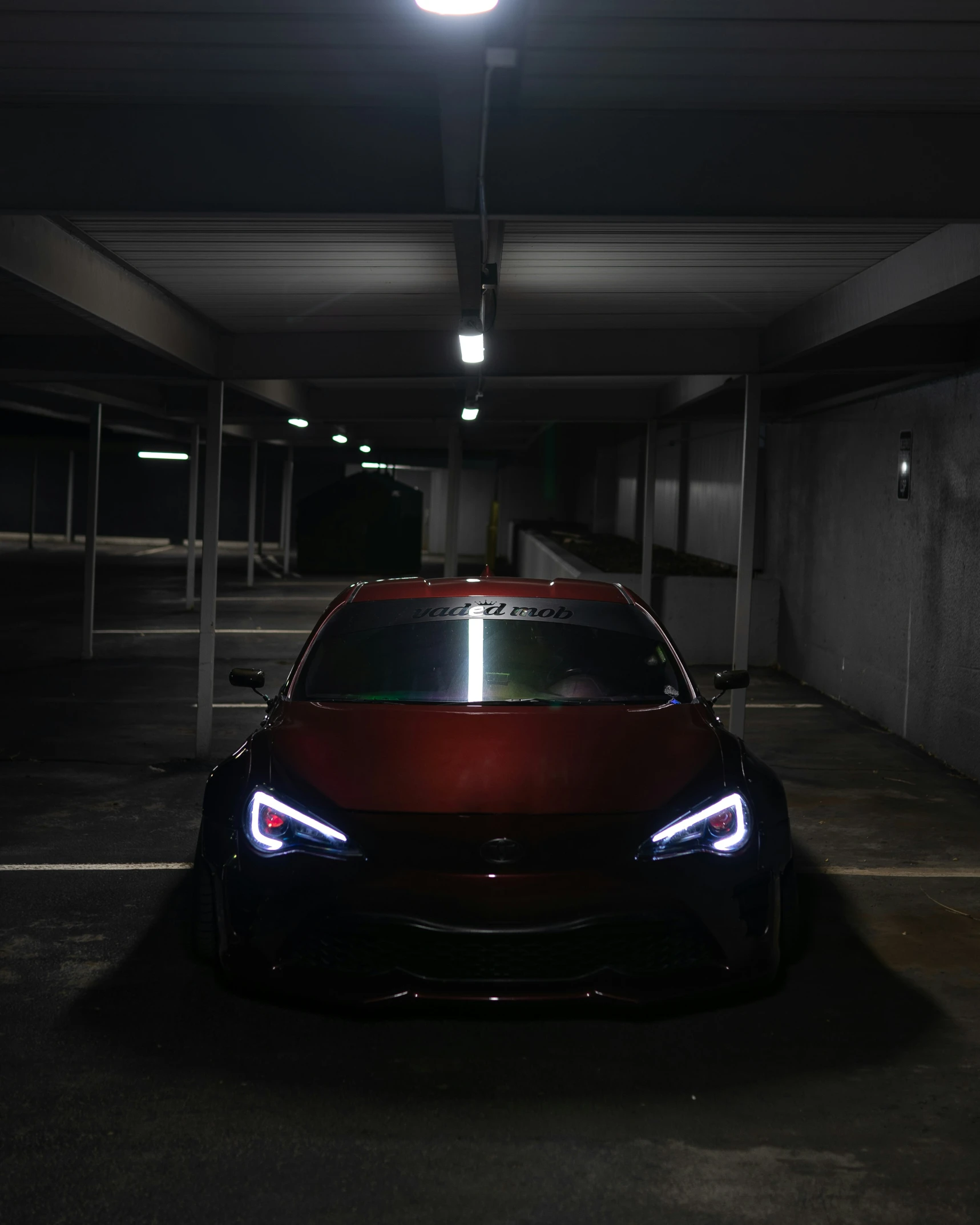 the car is in the parking garage, all shiny